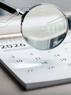 Calendar page for 2026 with magnifying glass, symbolising future Social Security COLA adjustments