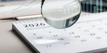 Calendar page for 2026 with magnifying glass, symbolising future Social Security COLA adjustments