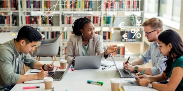Graduate students discussing funding options in a university library.