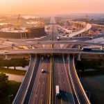 US Infrastructure Bill: £75B for Roads & Bridges Q2 2026 Modern highway interchange with bridges, symbolising US infrastructure investment