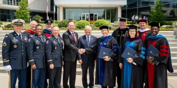 Veterans celebrating educational achievements at a university campus, highlighting the success of education benefits.